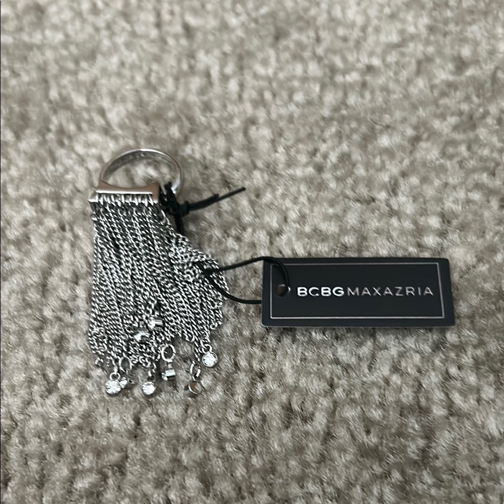 BCBGMaxAzria Silver Dangling Ring Accessory.